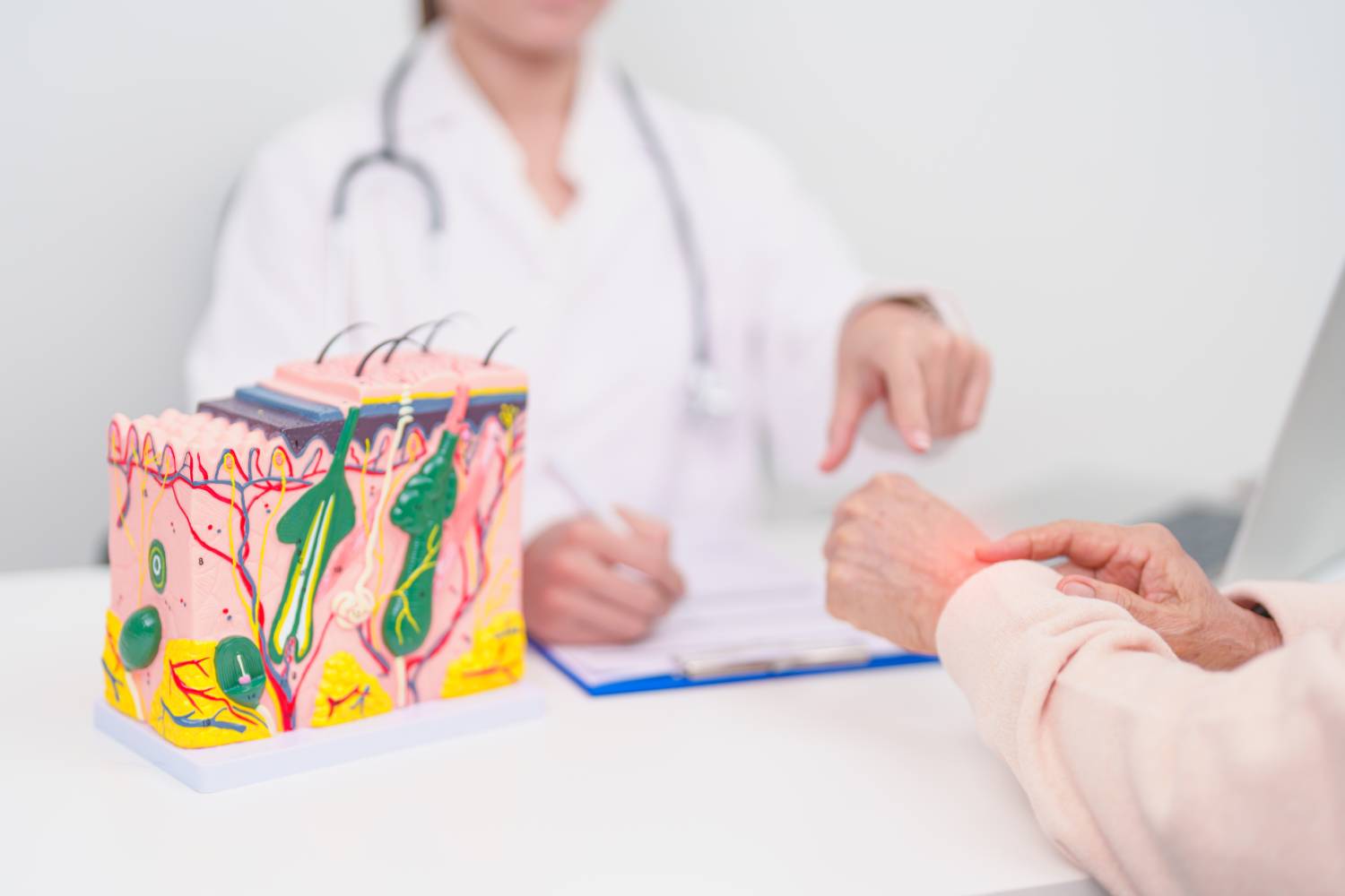 A female patient with skin condition having a consultation with a dermatologist. 