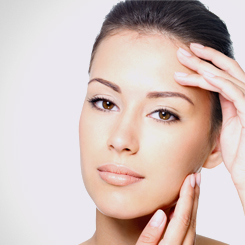 Woman looking forward with smooth, youthful skin